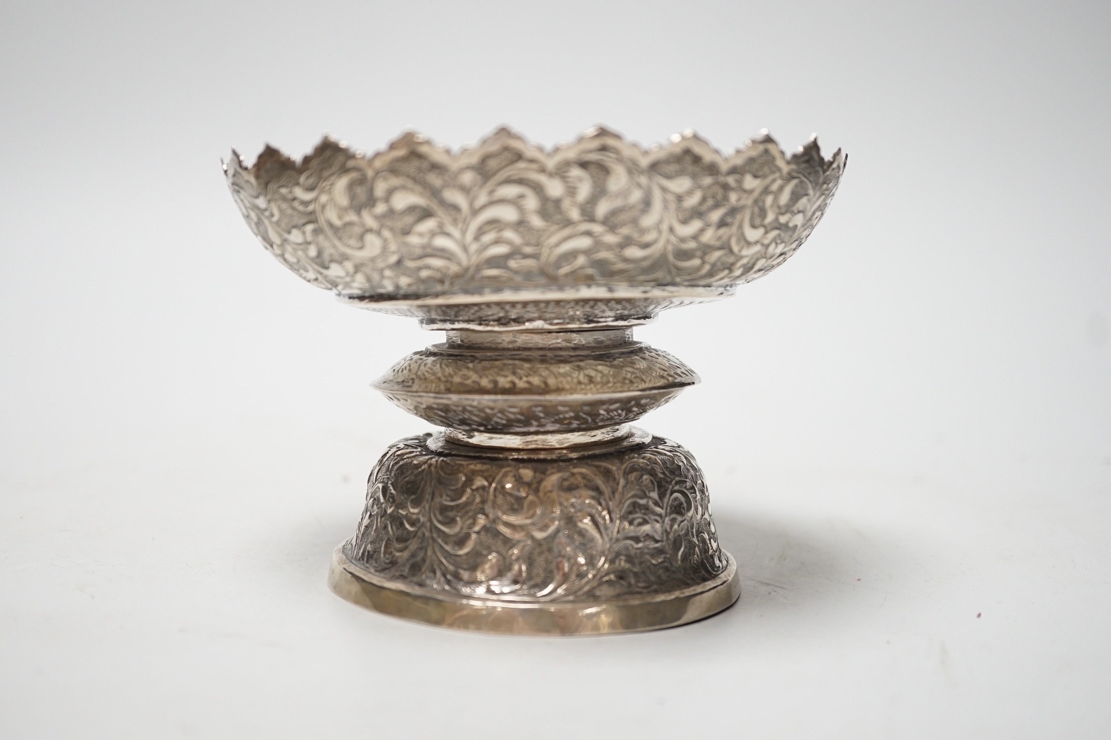 A Chinese Straits embossed white metal stem bowl, diameter 13cm, 172 grams.